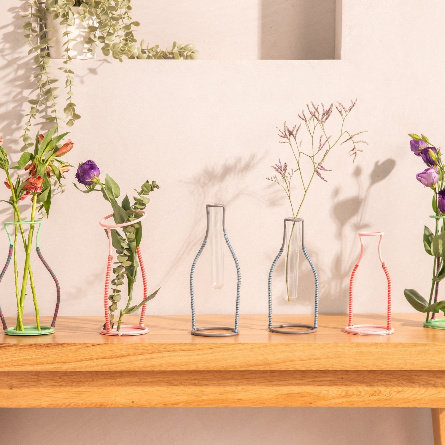 Assorted metal silhouette/line vases for living room – House of Ekam